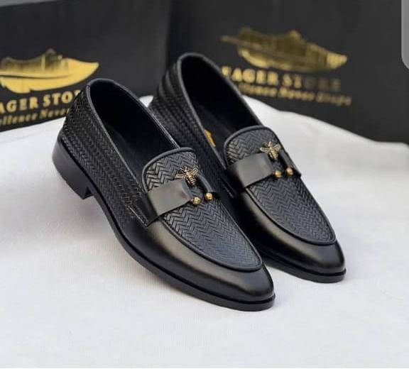 Black textured loafers with the signature bee accent.